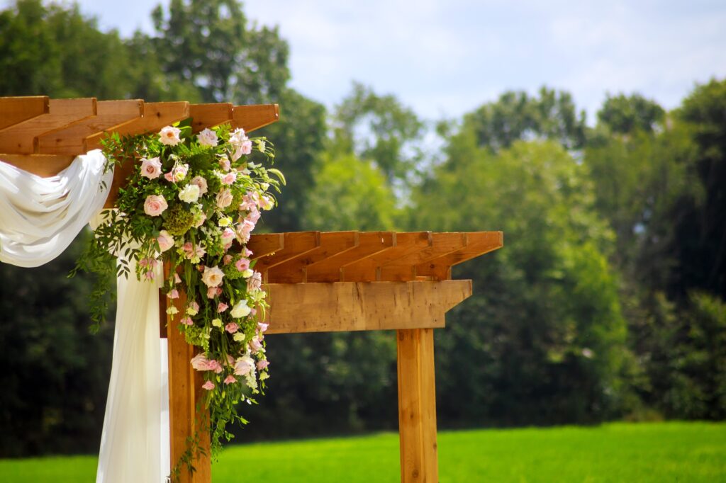 Wedding decoration. Arrangement of fresh flowers outside.